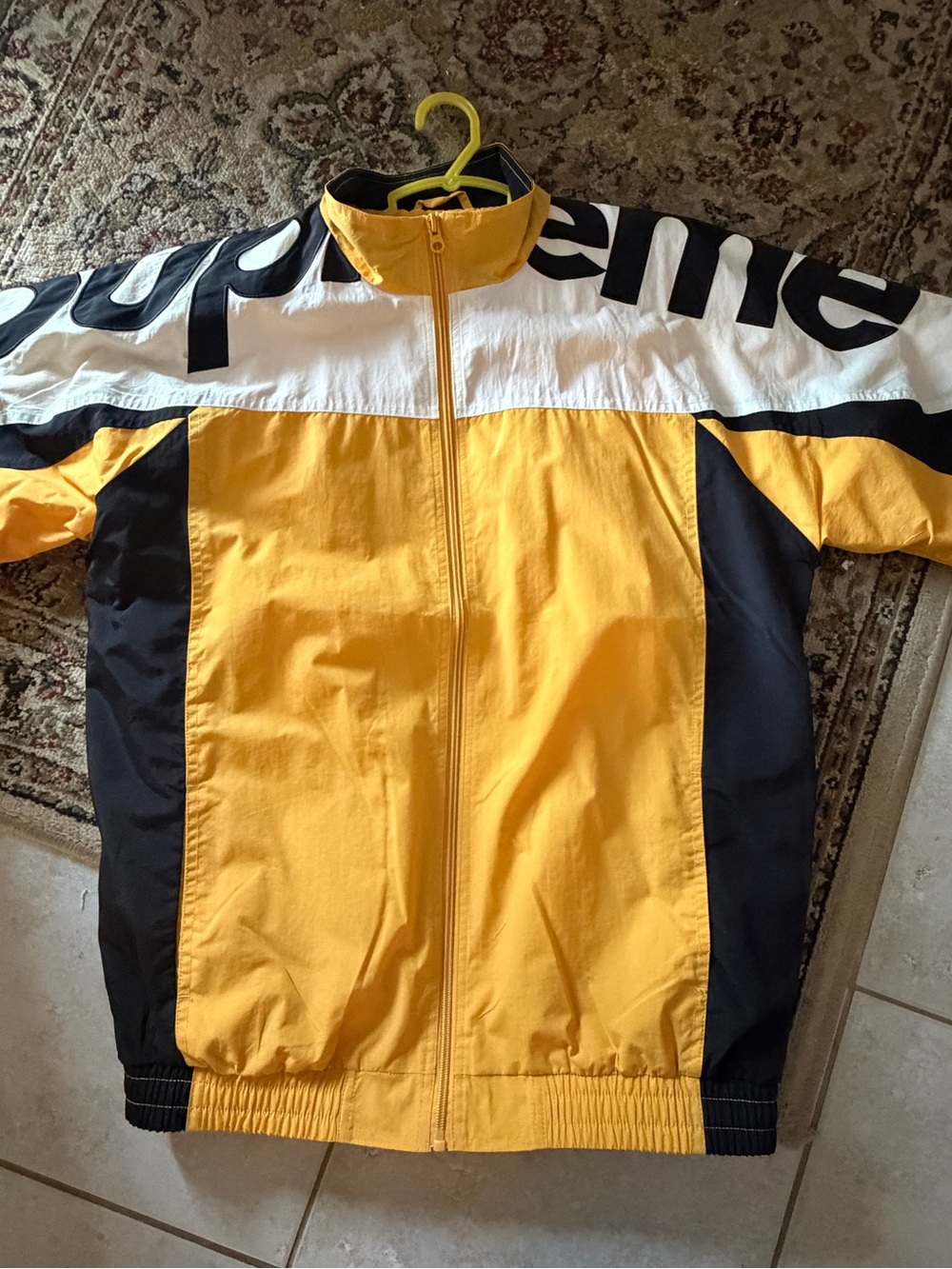 Supreme Yellow and Black Colorblock Jacket with Red Logo